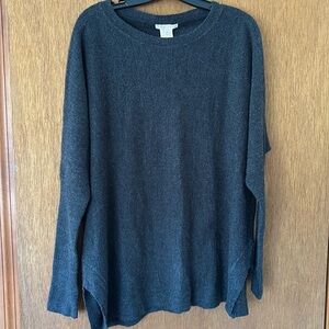 This sweater is actually charcoal, size L, Very soft fabric, acrylic. Side slits